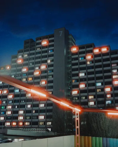 View of the Olympiadorf Wohnanlage in Munich, Germany at night.